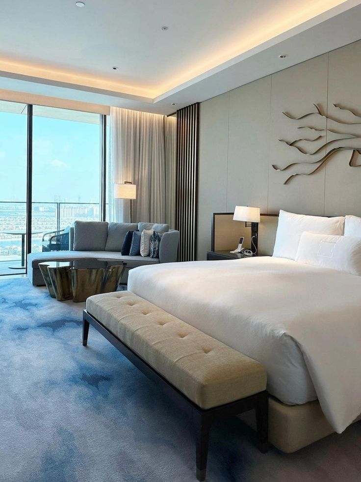 Cool-toned guest room with minimal design